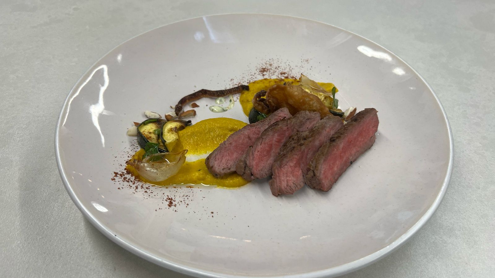 Sliced beef with saffron puree and courgette