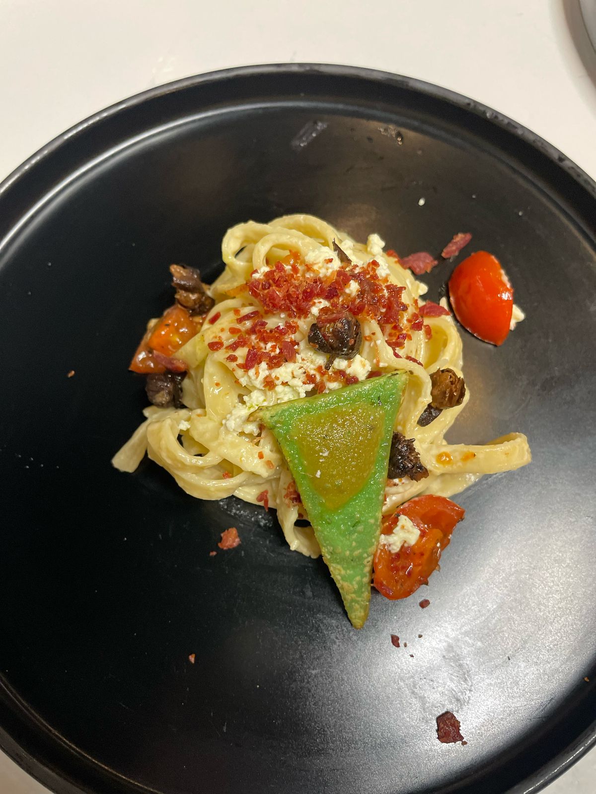 Pasta with pesto and crisp garnish