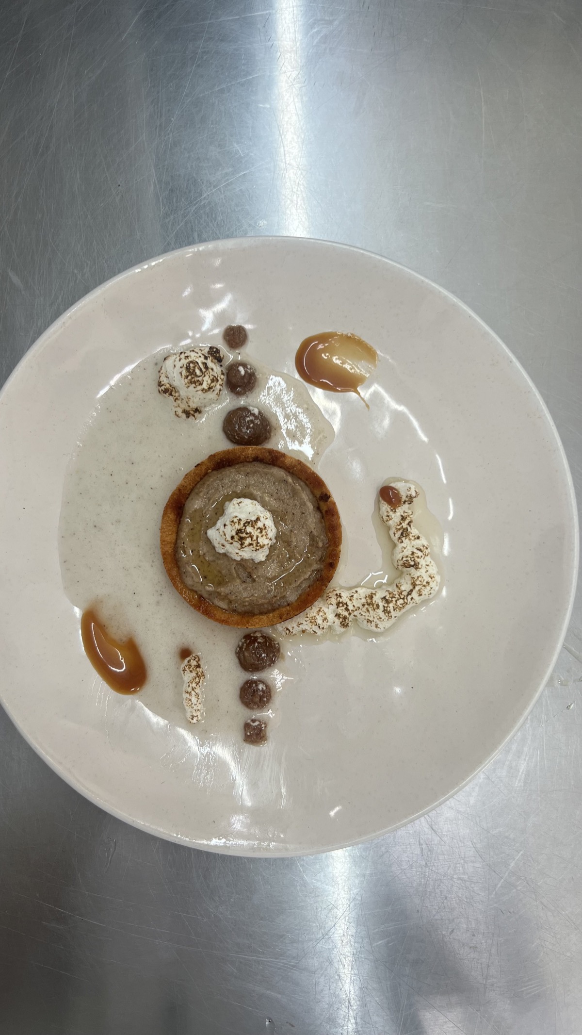 Tart dessert with cream dots