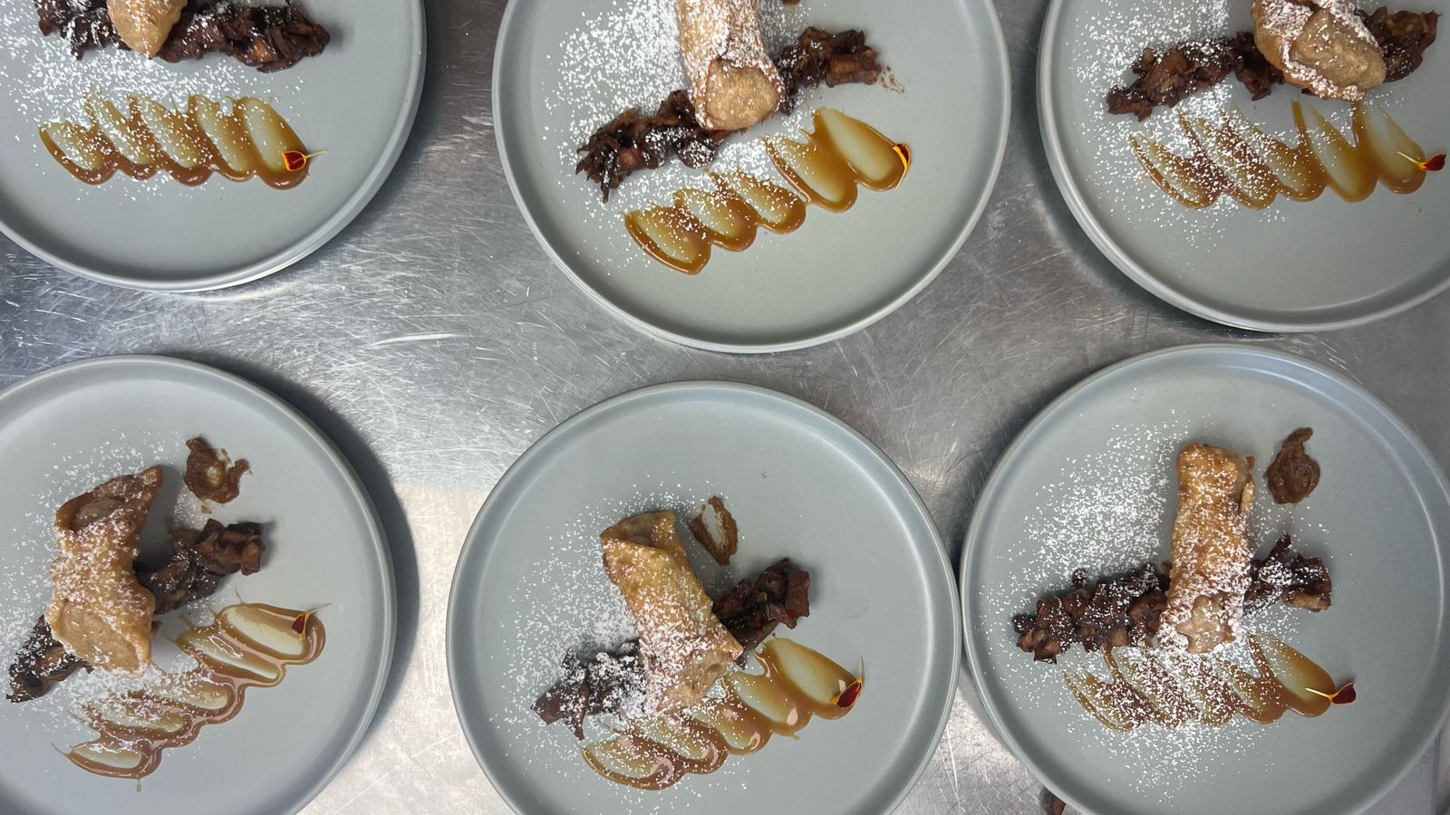 Batch dessert plating in kitchen